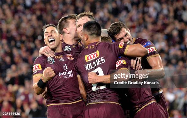 Billy Slater of Queensland and team mates are seen celebrating a try by team mate Daly Cherry-Evans during game three of the State of Origin series...