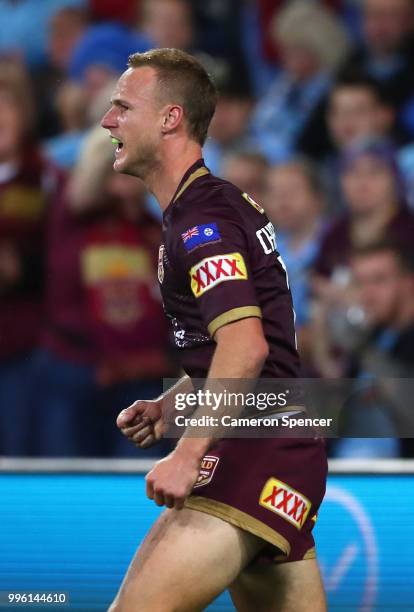 Daly Cherry-Evans of Queensland celebrates scoring a try during game three of the State of Origin series between the Queensland Maroons and the New...