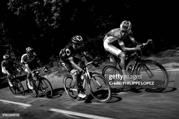 France's Anthony Perez, France's Jerome Cousin, Belgium's Guillaume Van Keirsbulck and Belgium's Dimitri Claeys ride during their four-men breakaway...