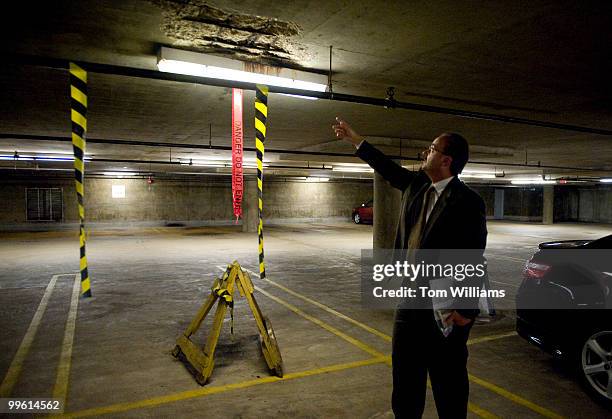 Mark Italiano, Project Manager House Office Building, points out damage to the ceiling of the East House Underground Garage, caused by melting salt...