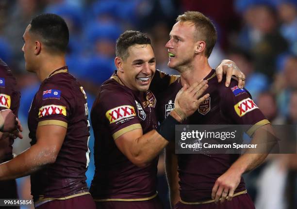 Daly Cherry-Evans of Queensland is congratulated by Billy Slater after scoring a try during game three of the State of Origin series between the...