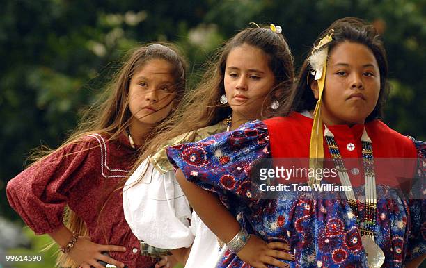 From left, Christina Diaz Megan Byers and Tanis Torres perform with the James Kunestsis Apache Crown Dancer Group from Mescalero, N.M., outside of...