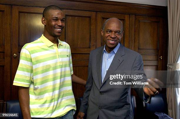 Olympic gold medalist in speed skating Shani Davis, left, talk with Rep. William Jefferson, D-La., at a reception for Congressional Black Caucus...