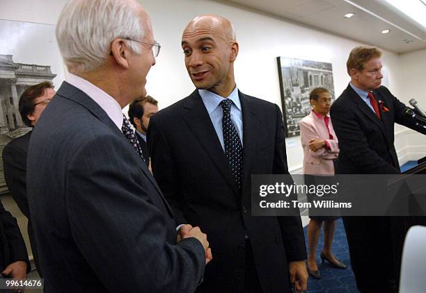 Mayor Adrian Fenty, center, talks with Rep. Chris Shays, R-Conn., at a news conference after the House approved the District of Columbia House Voting...