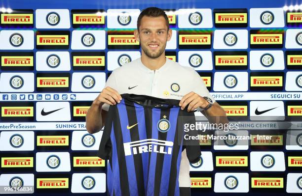 Internazionale new signing Stefan De Vrij poses with the club shirt during a press conference at the club's training ground Suning Training Center in...