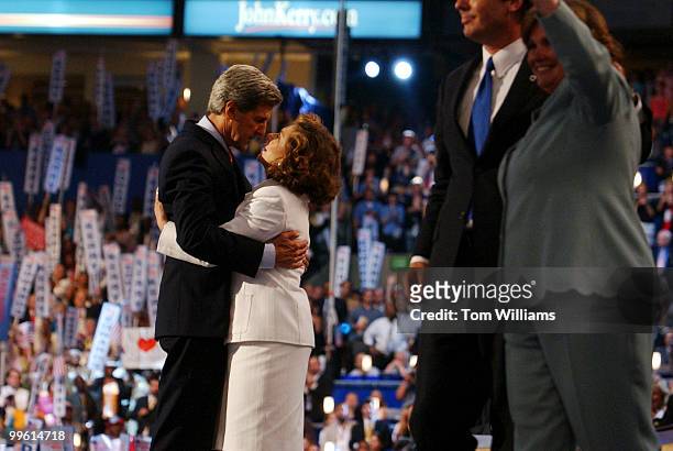 Sen. John Kerry, D-Mass., hugs his wife Teresa Heinz Kerry, on the night was nominated as the presidential candidate, at Democratic National...
