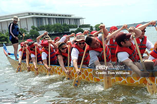 Team from of Cornell University alumni shove off into the Potomac River to race into the D.C. Dragon Boat Festival, June 1, 2008.
