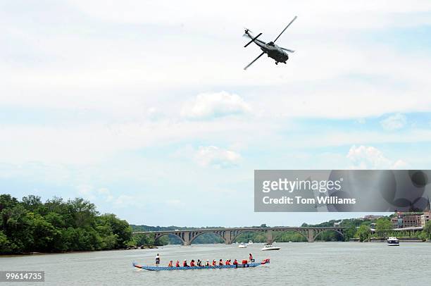 Marine helicopter flies over the D.C. Dragon Boat Festival, held on the Potomac River in between the Kennedy Center and Key Bridge, June 1, 2008.