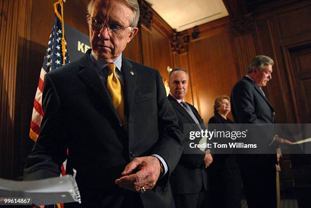 Senate Majority Leader Harry Reid, D-Nev., reads a note as Harold Schaitberger, president, International Association of Fire Firefighters, speaks at...