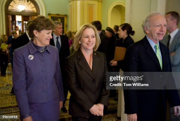 From left, Sens. Jeanne Shaheen, D-N.H., Kirsten Gillibrand, D-N.Y., and Joe Lieberman, I-Conn., make their way to a news conference after the...