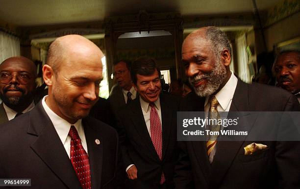 Frederick Douglass IV, walk through the house of his great, great, grandfather, with Reps. Jerry Weller, R-Ill., left, and Roy Blunt, R-Mo., after a...