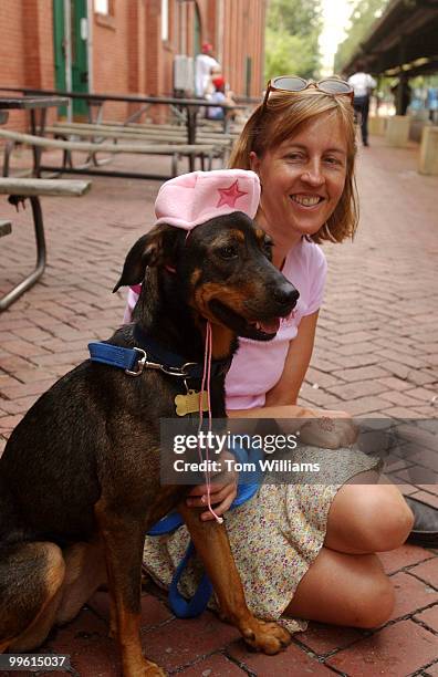 Karo" a one and half year old shepard mix models a pink beret featured in the movie "Legally Blonde 2" with her owner, Capitol Hill resident Cathy...