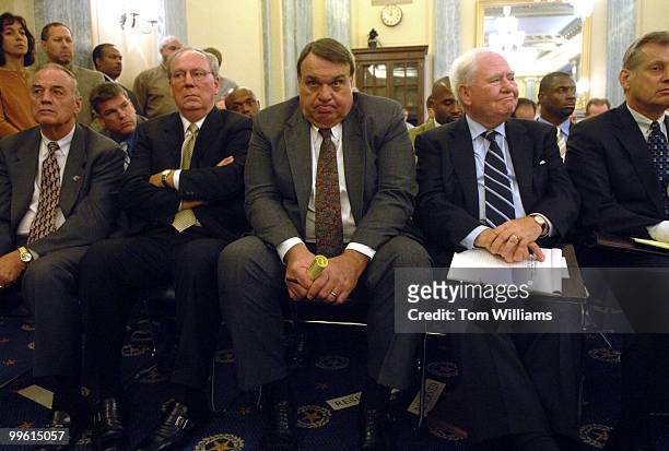 Bill Bain, center, former NFL player, listens to the second panel after testifying on the first, at a hearing on the NFL retirement system, focusing...