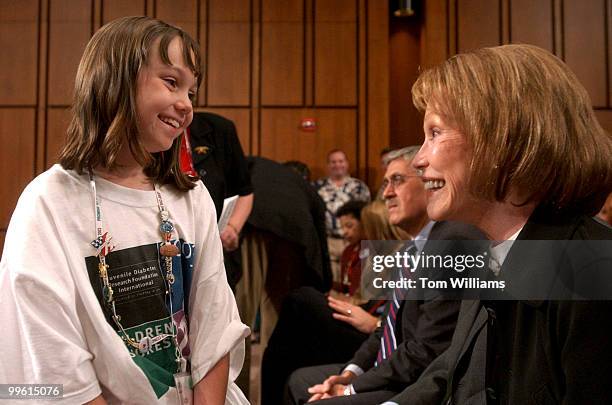 Abby Wolter of Alton, Ill., speaks to Actress and Chairman of the Juvenile Diabetes Research Foundation, Mary Tyler Moore during a hearing in which...