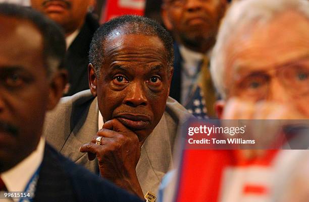 North Carolina delegate listens to Sen. John Edwards, D-N.C., on the night he was nominated as the vice presidential candidate, at Democratic...