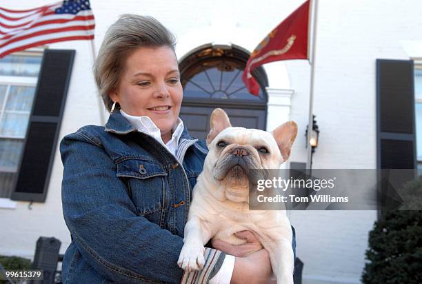 Westminster Dog Show best of breed winner, French bulldog "Wishbone" and handler Jodi Longmire pose in front of the Marine Barracks on 8th Street, SE.