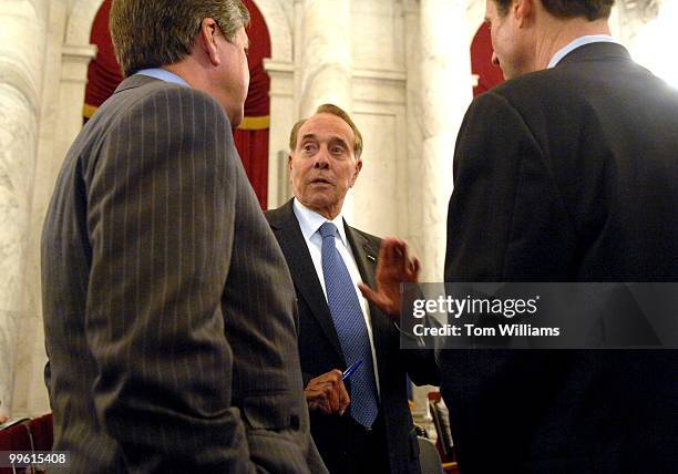 Former Senator Bob Dole speaks with Sens. Gordon Smith, R-Ore., left, and Ron Wyden, D-Ore., before a Senate Special Committee on Aging hearing on...