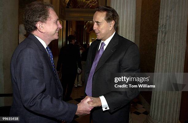 Former Sen. Bob Dole, R-KS, and Sen. Arlen Specter, R-PA, greet outside the Senate Chamber, Wednesday afternoon.