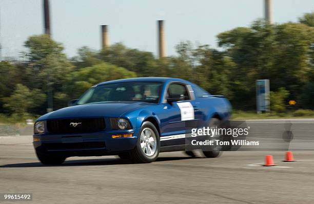 Ford Mustang goes into a skid during a course at RFK Stadium to educate teens about distractions while driving, Sept. 29, 2009. This task was...