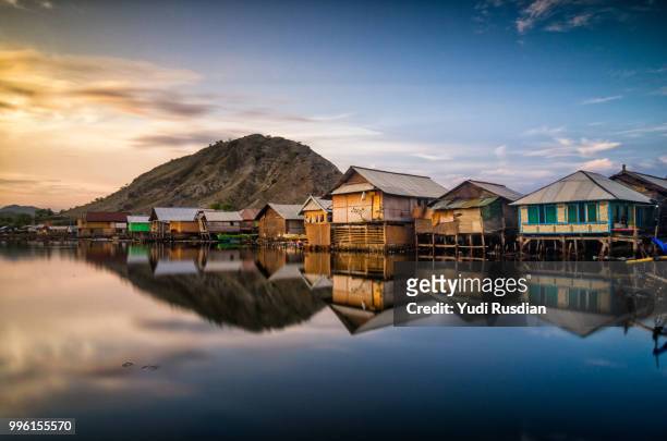 poto tano village by a lake in west sumbawa, indonesia. - sumbawa stockfoto's en -beelden