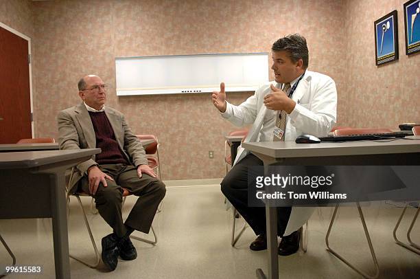 Dr. Chris Snyder talks with Rep. Wayne Gilchrest, R-MD, during a tour of the Peninsula Regional Medical Center, in Salisbury, Maryland.