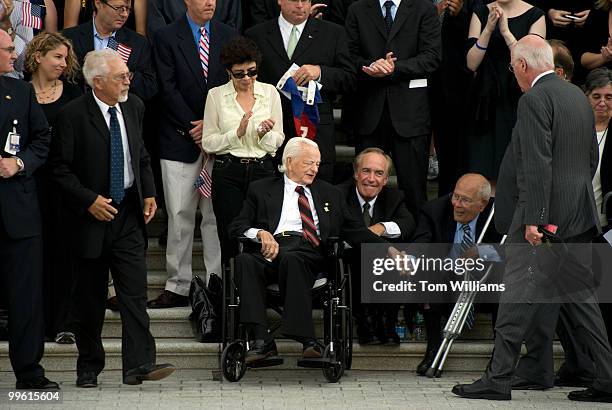 Sen. Robert Byrd, D-W.V., center, greets Rep. John Dingell, D-Mich., while waiting for the arrival of the motorcade containing the body of the late...