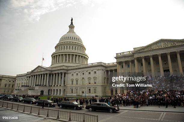 The motorcade containing the body of the late Senator Edward Kennedy makes a stop on the east front of the Capitol for a brief ceremony before...