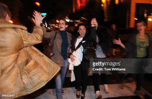 Election night revelers make their way down 16th Street, NW, to celebrate at the White House after Barack Obama was voted president of the United...