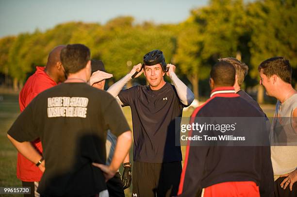Rep. Duncan Hunter, R-Calif., dons a rugby helmet during a flag football practice on the Mall, Oct. 8 in preparation for the upcoming game in which...