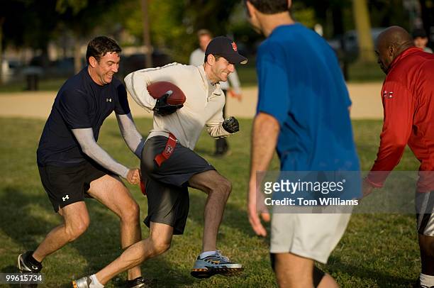 Rep. Paul Ryan, R-Wic., tries to evade defender Rep. Duncan Hunter, R-Calif., during a flag football practice on the Mall, Oct. 8 in preparation for...