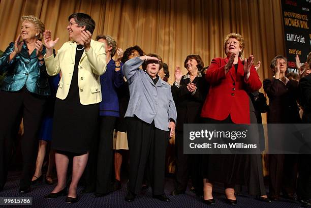 Sen. Barbara Mikulski, D-Md., center, Sen. Debbie Stabenow, D-Mich., right, in red, and Ellen Malcolm, far left, in green, president of Emily's List,...