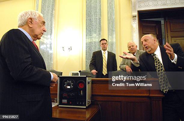 Jerry Gabbard, right, vice president and general manager NAFTA region, Siemens VDO, explains one of their products, the Electronic On-Board Recorder...