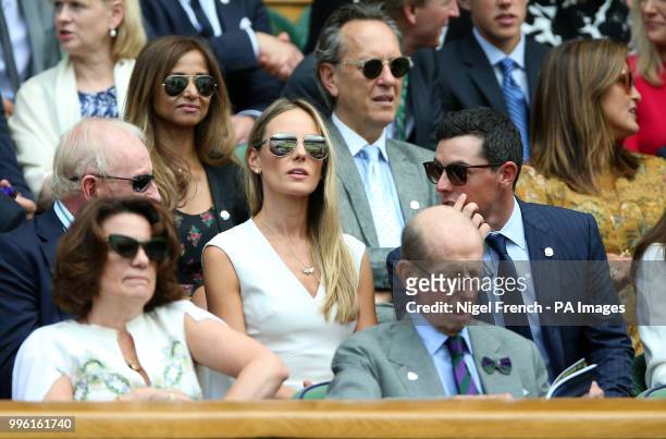 Rory McIlroy , Erica Stoll and Rod Laver in the royal box on centre court on day nine of the Wimbledon Championships at the All England Lawn Tennis...