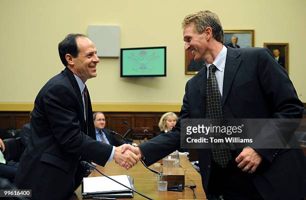 Glenn Fine, left, Justice Department Inspector General, greets Rep. Jeff Flake, R-Ariz., before a House Foreign Affairs Subcommittee hearing on the...