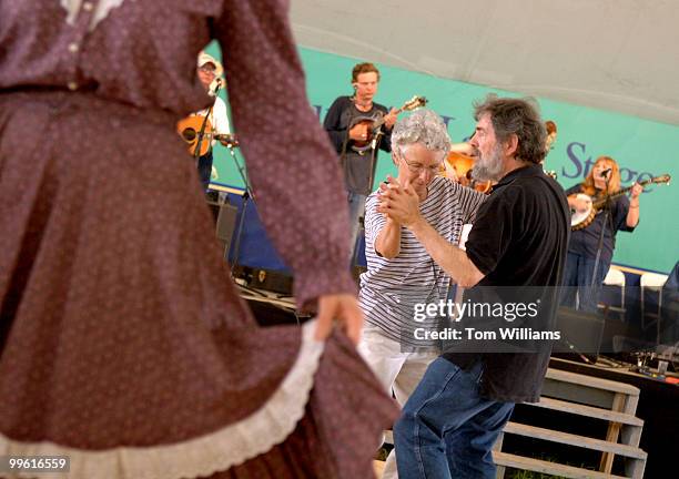 Sara Stacy and Tom Esler dance to bluegrass music in the Virginia Roots section of the Smithsonian Folklife Festival.