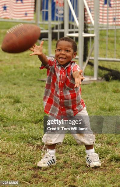 Logan Fitzgerald of Temple Hills , Md., tries to catcha pass at the NFL Kickoff Fottball Festival held on the National Mall. The event featured...