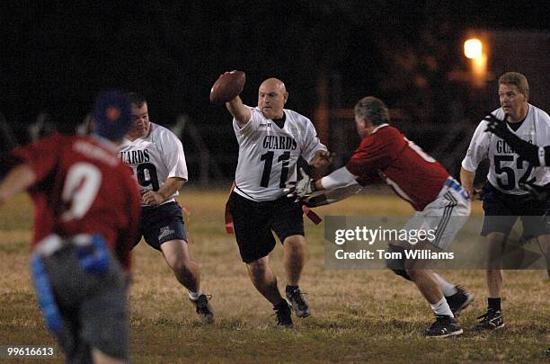 Mark Herbert of the Capitol Police rushes while playing quarterback during the the 3rd Biennial Longest Yard Fall Classic played at Eastern High...