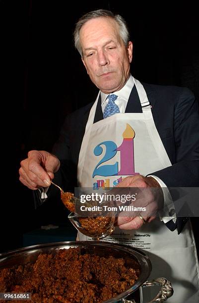 Secretary of Commerce Donald Evans, serves Texas Red Chili, at the March of Dimes 21st Annual March of Dimes Gala, at the National Building Museum.