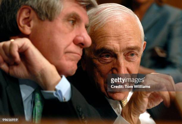 Sen. Frank Lautenberg, D-N.J., right, has a word with Sen. Ben Nelson, D-Neb., during a hearing on gasoline price gouging.
