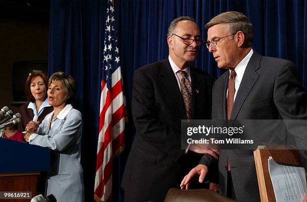 Sen. Chuck Schumer, D-N.Y., has a word with Sen. Byron Dorgan, right, while Sens. Maria Cantwell, D-Wash., left, and Barbara Boxer, D-Calif., speak...