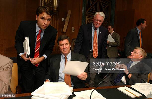 From left, Sen. George Allen, R-Va., seated, Sen. Jim Bunning, R-Ky., and Sen. Conrad Burns, R-Mont., get prepare for a hearing of the Senate Energy...