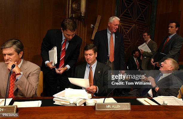 From left, Sen. Gordon Smith, R-Ore., an unidentified staffer, Sen. George Allen, R-Va., Sen. Jim Bunning, R-Ky., and Sen. Conrad Burns, R-Mont., get...