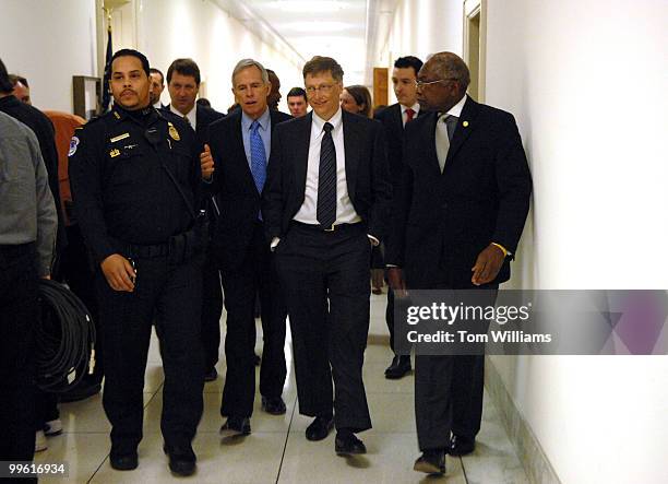 Bill Gates, center, chairman of Microsoft, walks from a House Science & Technology Committee hearing with chairman of the Committee Bart Gordon,...