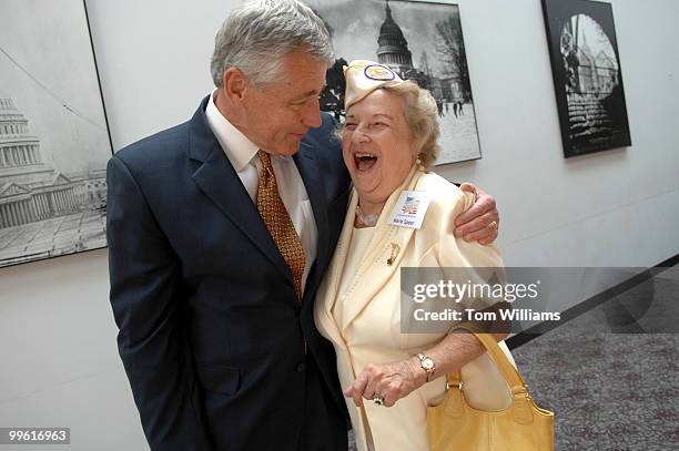 Sen. Chuck Hagel, R-Neb., hugs Gold Star Wives founder Marie Speer, during an awards ceremony honoring members of Congress who have aided surviving...