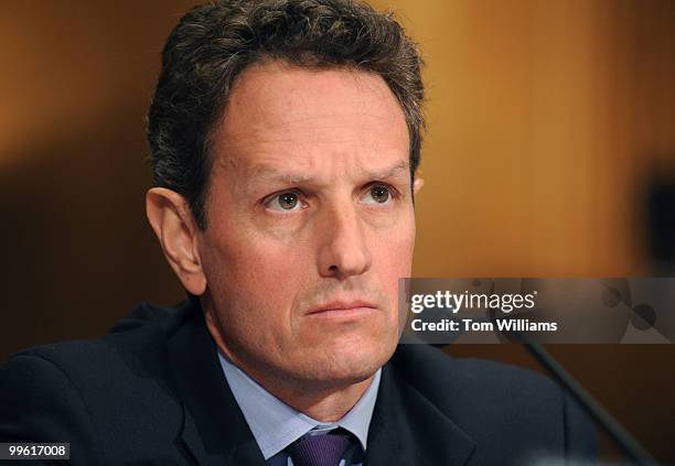 Timothy Geithner, nominee for Secretary of the Treasury, listens to opening statements during his confirmation hearing before the Senate Finance...