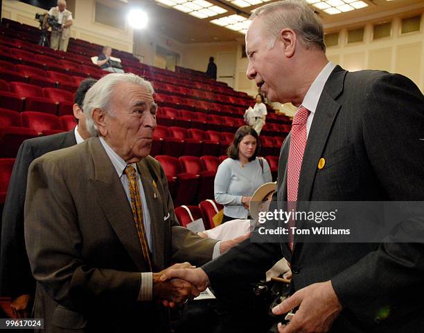 Former congressman Ben Gilman, R-N.Y., left, greets former Gerald Ford administration staff member David Gergen, after a tribute to the former...