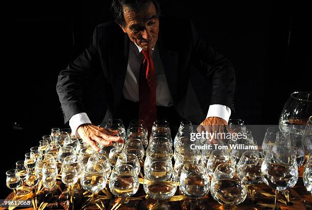 Jamey Turner plays the glass harp during a reception at the National Aquarium which held a reopening reception at it's location in the lower level of...