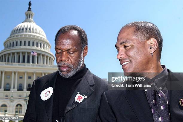 At left, actor Danny Glover and Phil Wilson, Executive Director of the African American AIDS and Policy and Training Institute, attend a rally on the...