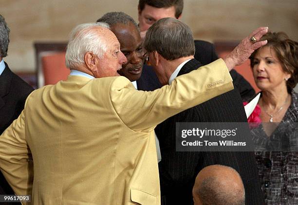 Tommy Lasorda waves to the crowd while Rep. David Scott, D-Ga., center, talks with Commisioner of MLB Bud Selig, before the Congressional Gold Medal...