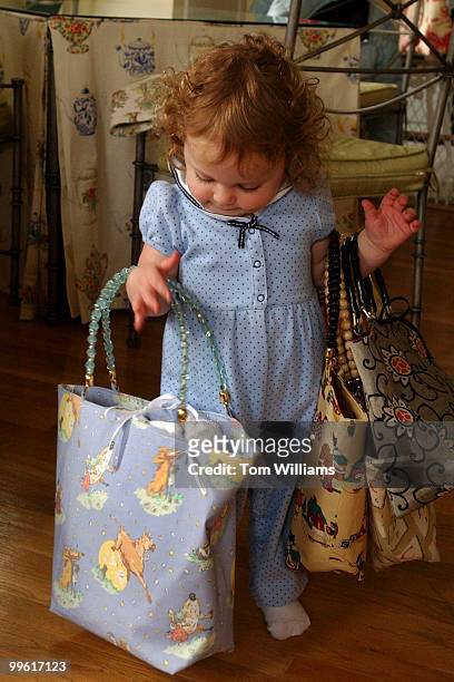 Handsbags by Chantal Weinecke held by her daughter Kendall, age one and a half..
